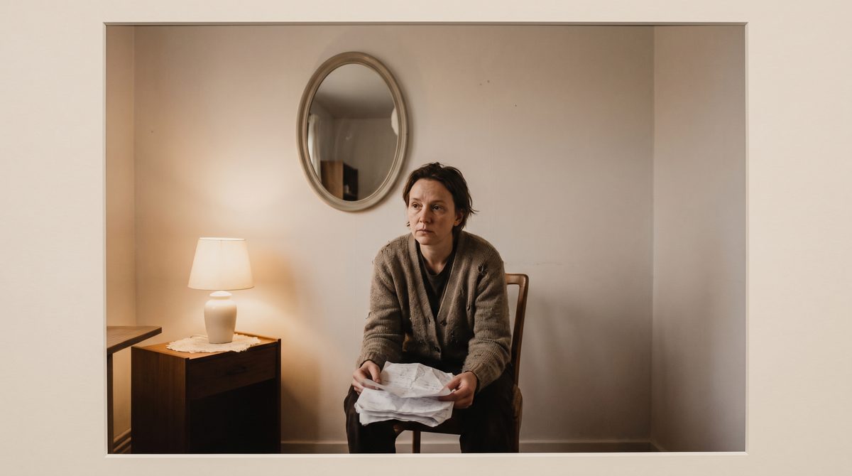 An actor sitting alone in a trailer with script pages, waiting to be called