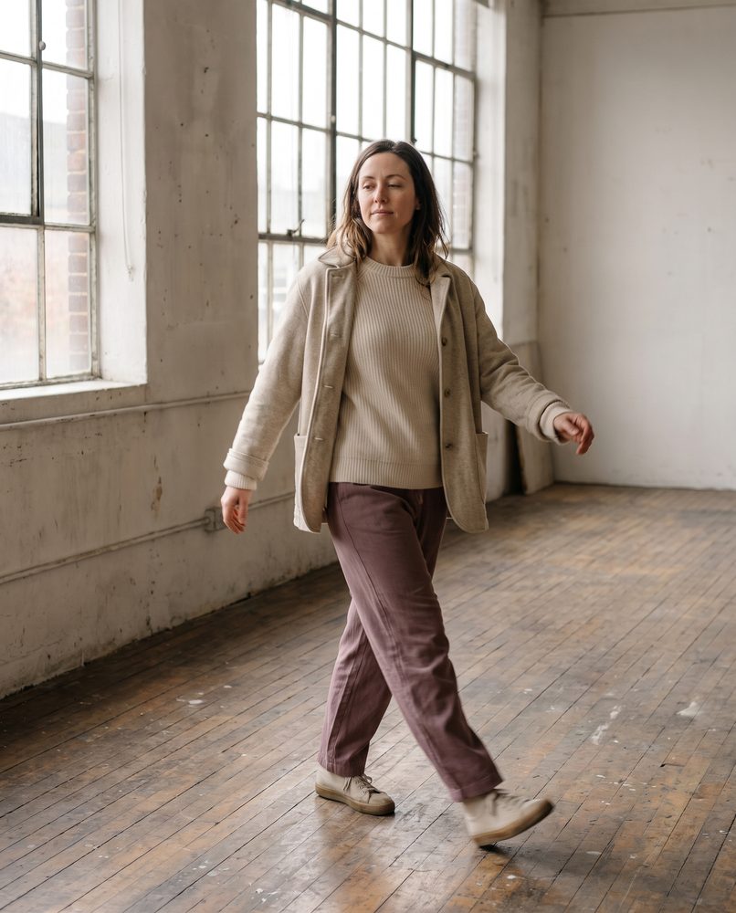 An actor walking a character across a bare studio floor