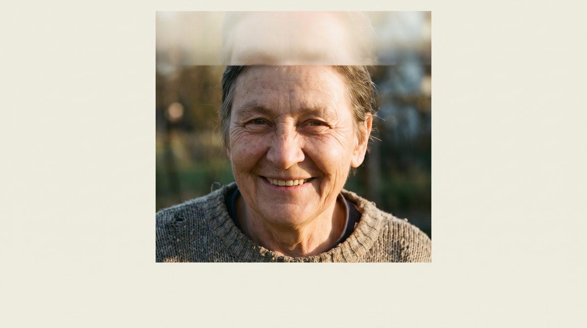 A close view of a face showing the eyes crinkling at the outer corners in a real smile