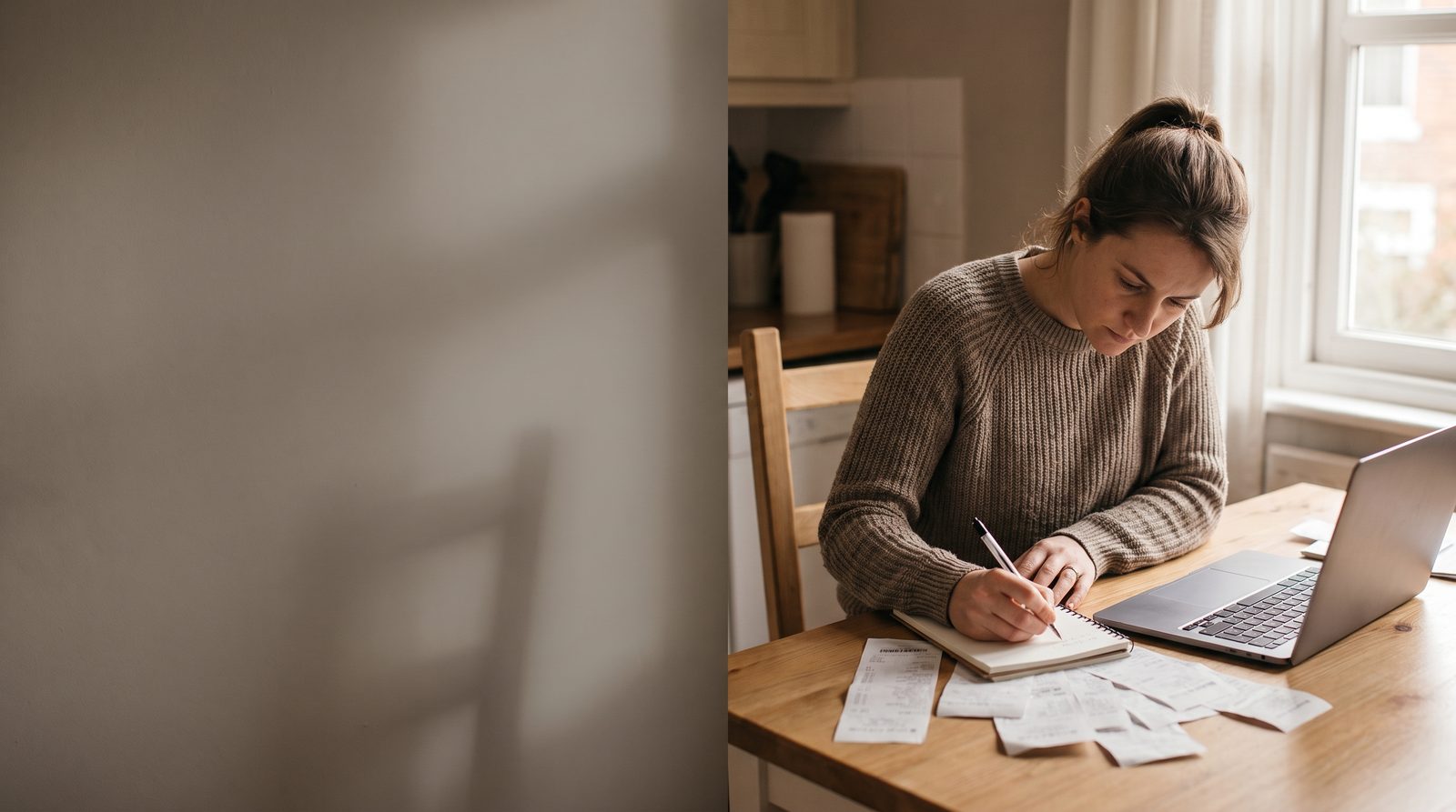 An actor at a kitchen table with a laptop and a pile of receipts, working out a budget