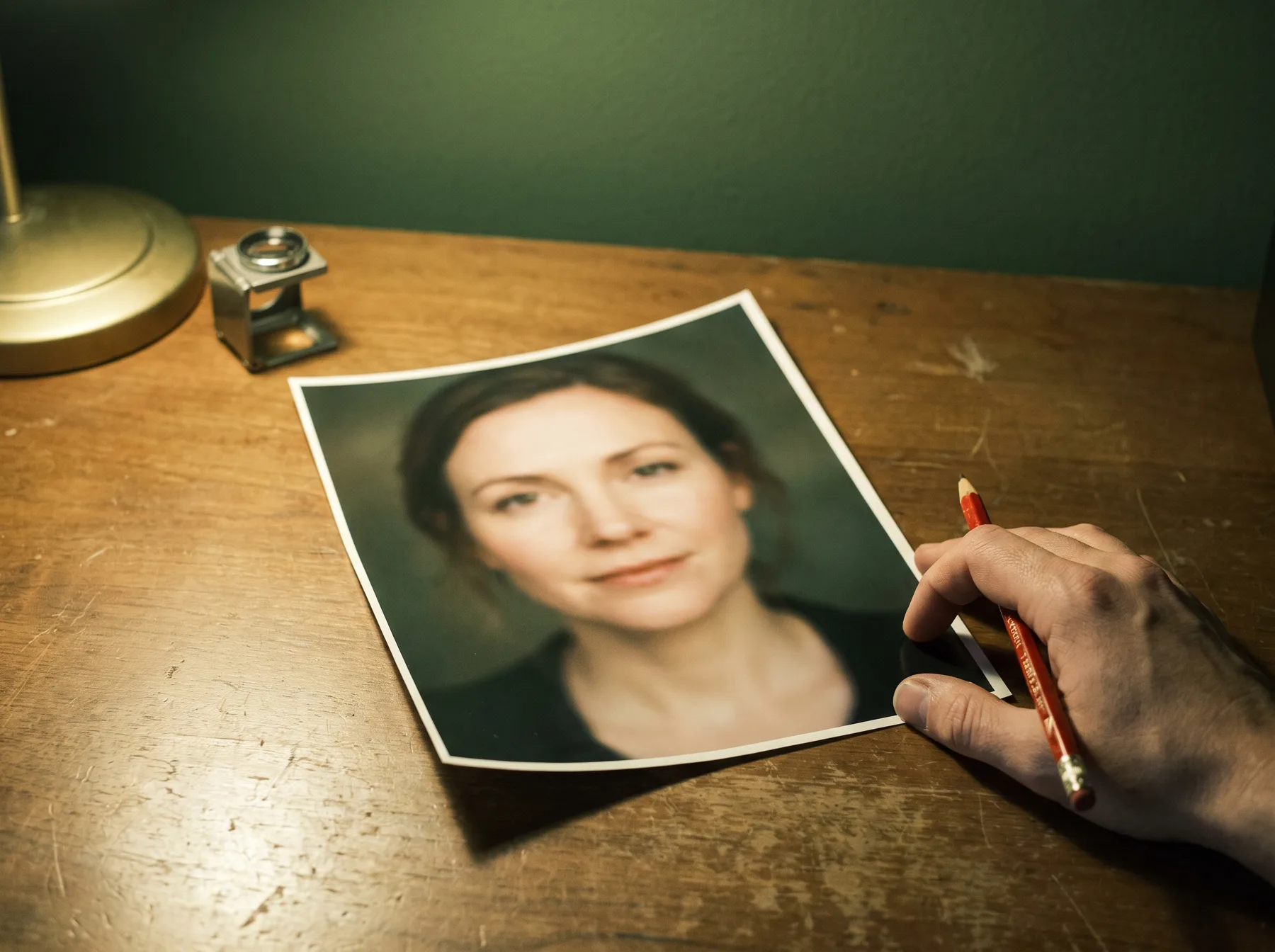 A professional headshot photographer reviewing an actor during a session