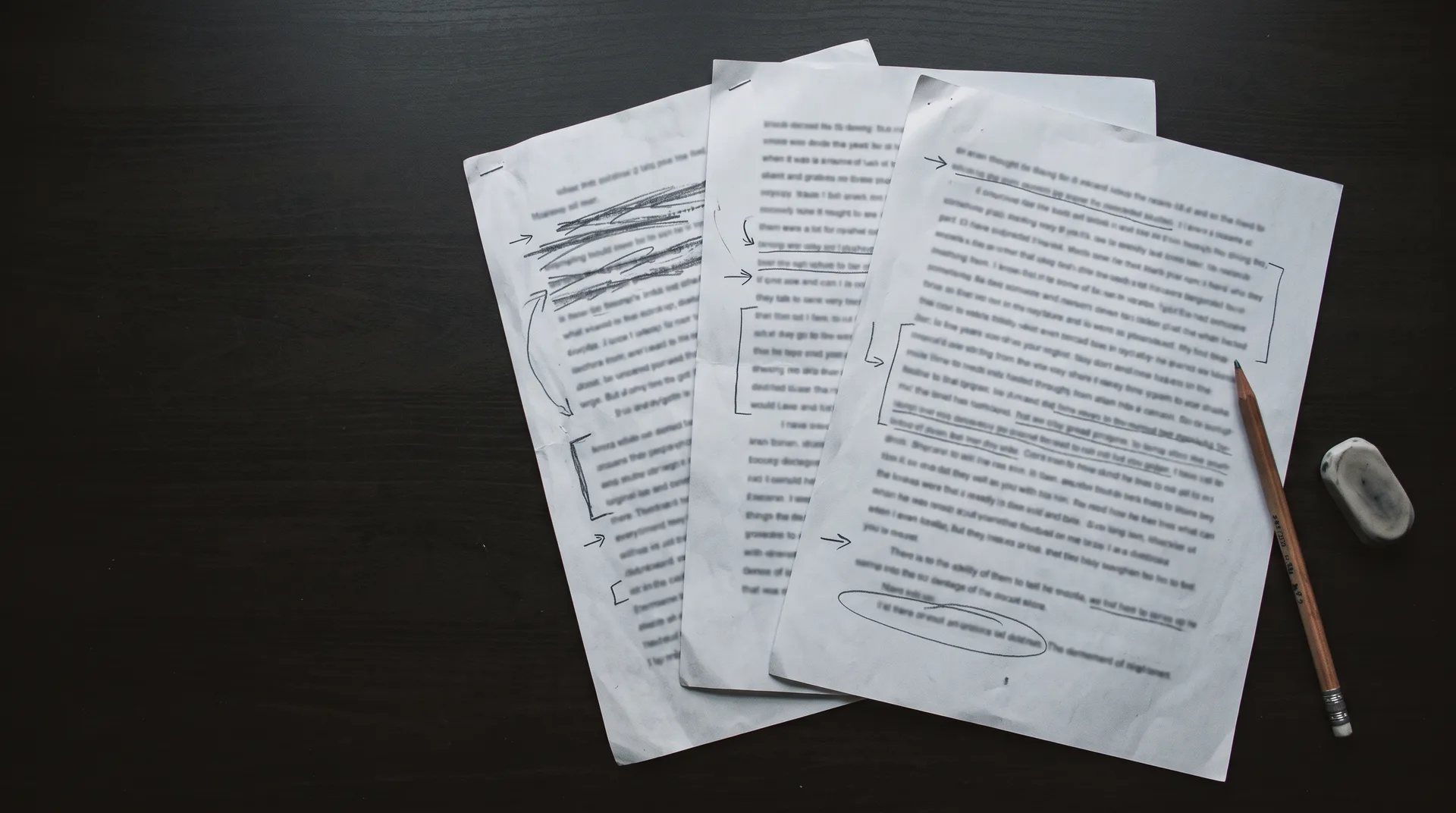 Pages of a typed monologue draft covered in pencil corrections, arrows and crossings out
