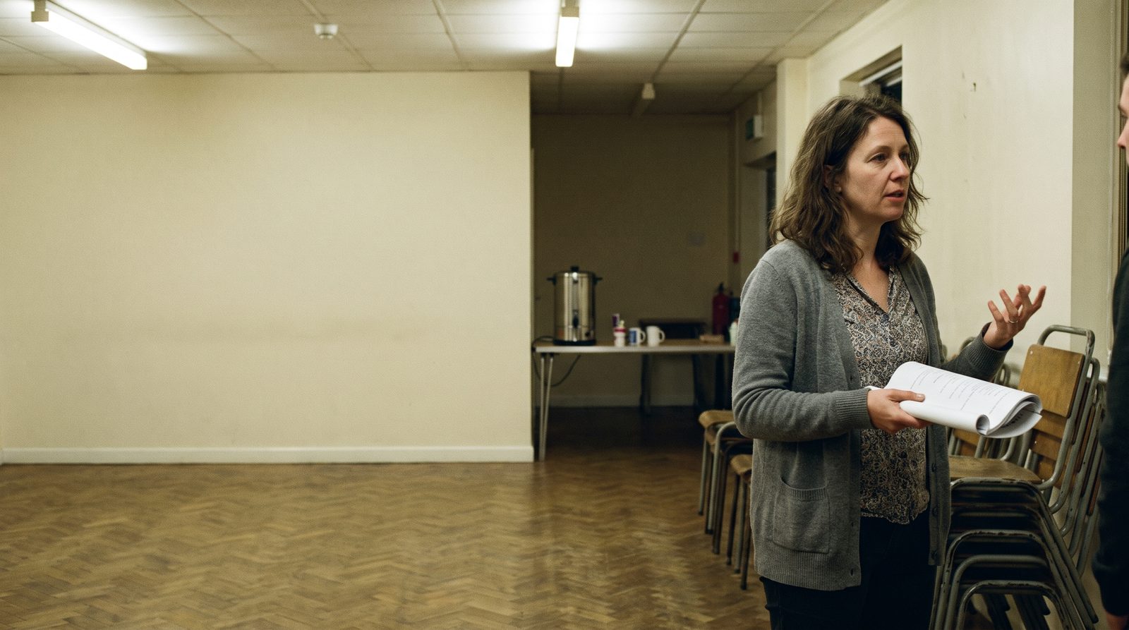 A village hall set up for an adult drama class on a weekday evening