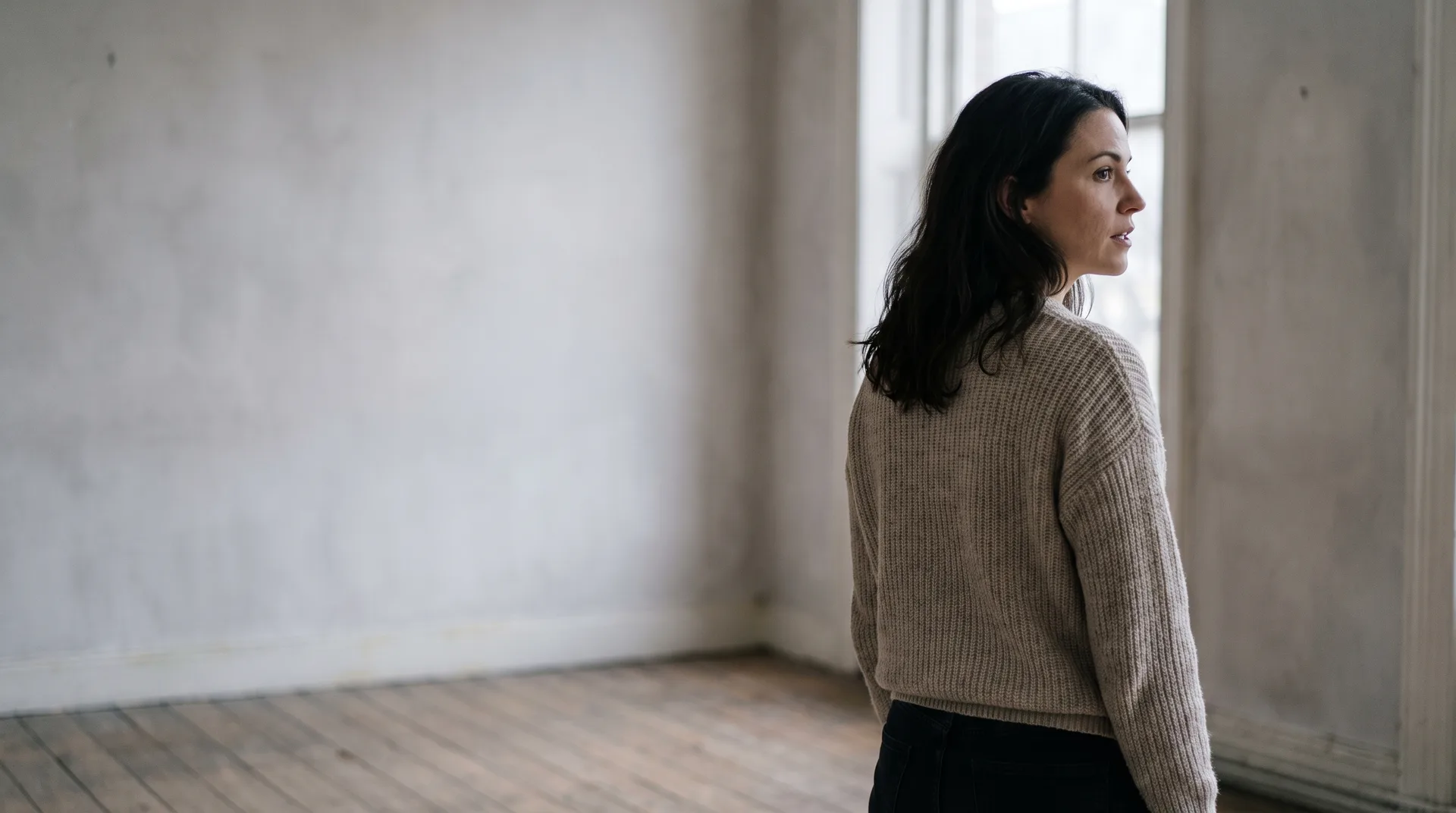 An actor speaking quietly and dry-eyed in a rehearsal room