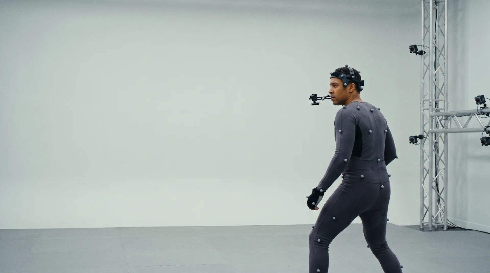 An actor in a motion capture suit performing in a capture volume